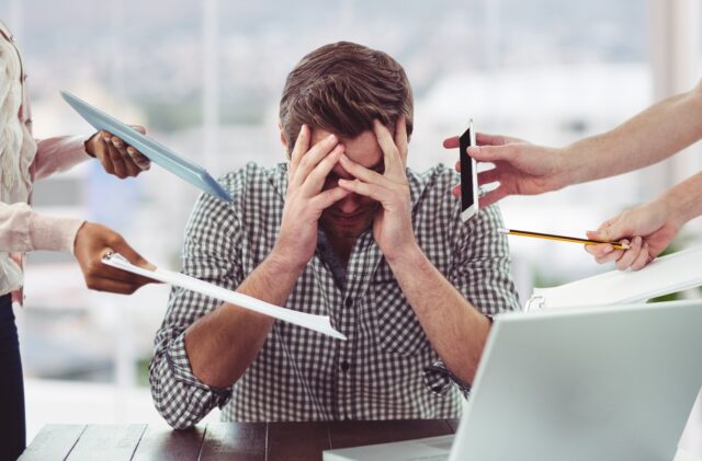 Stressed man frustrated with electronic devices